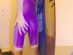 young boy in tight short swimsuit showing closer