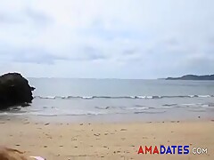 Dionne Daniels strips on the beach
