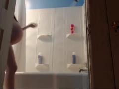 Pregnant woman taking a shower